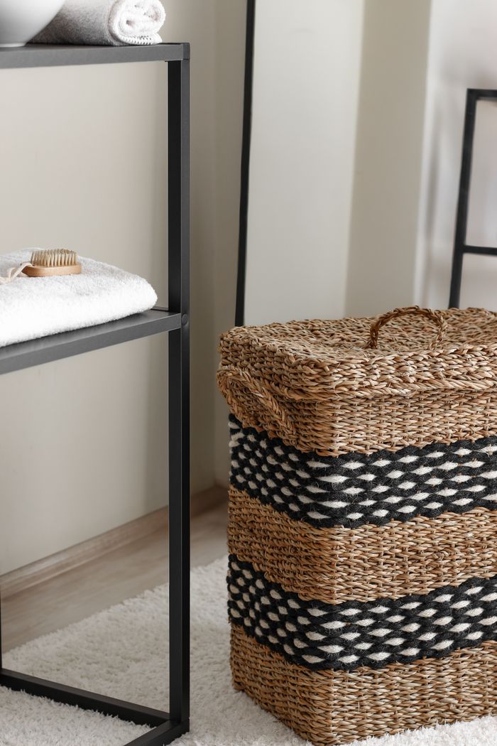 social-feed-img-01 Elegant woven laundry basket in a modern bathroom interior, showcasing minimalist design and stylish details.